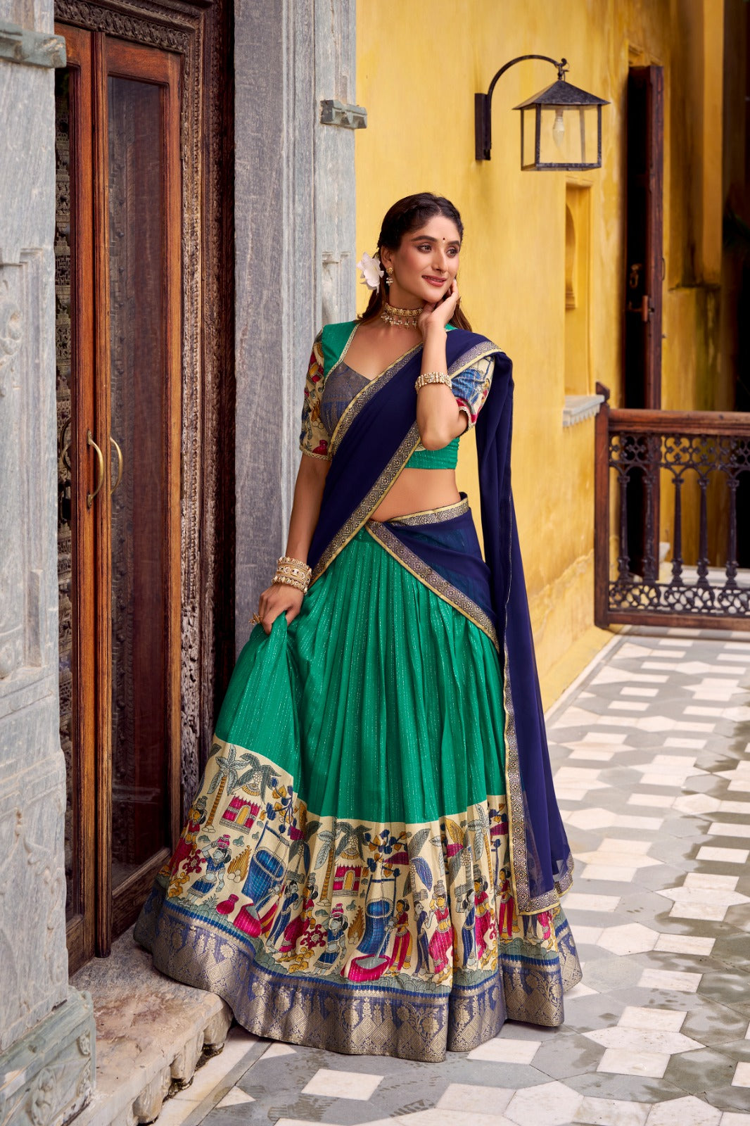 Kyatri New Elegance with this Poly Chanderi lehenga, designed with delicate Zari stripes and enhanced with Kalamkari prints