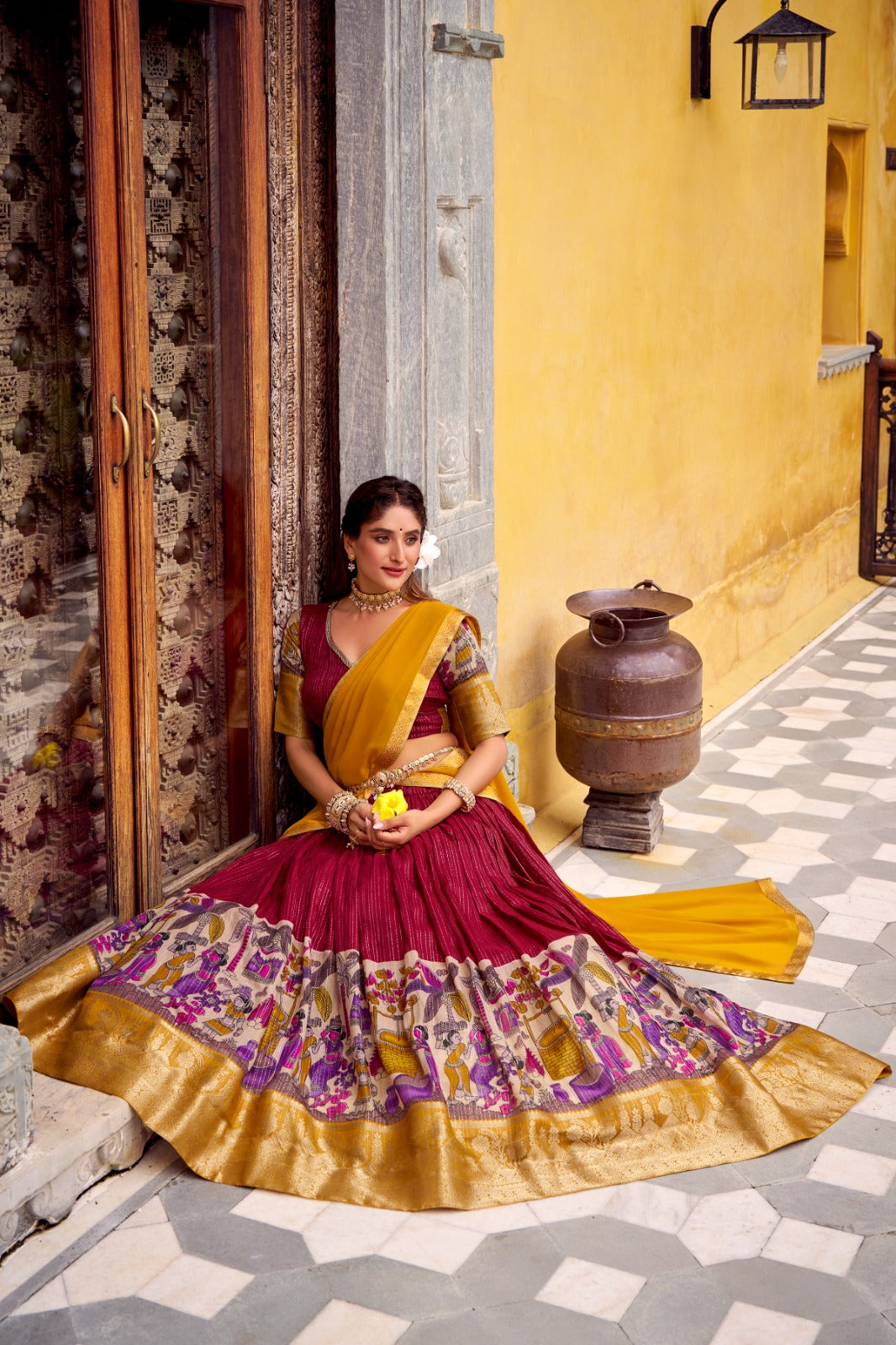 Kyatri New Elegance with this Poly Chanderi lehenga, designed with delicate Zari stripes and enhanced with Kalamkari prints