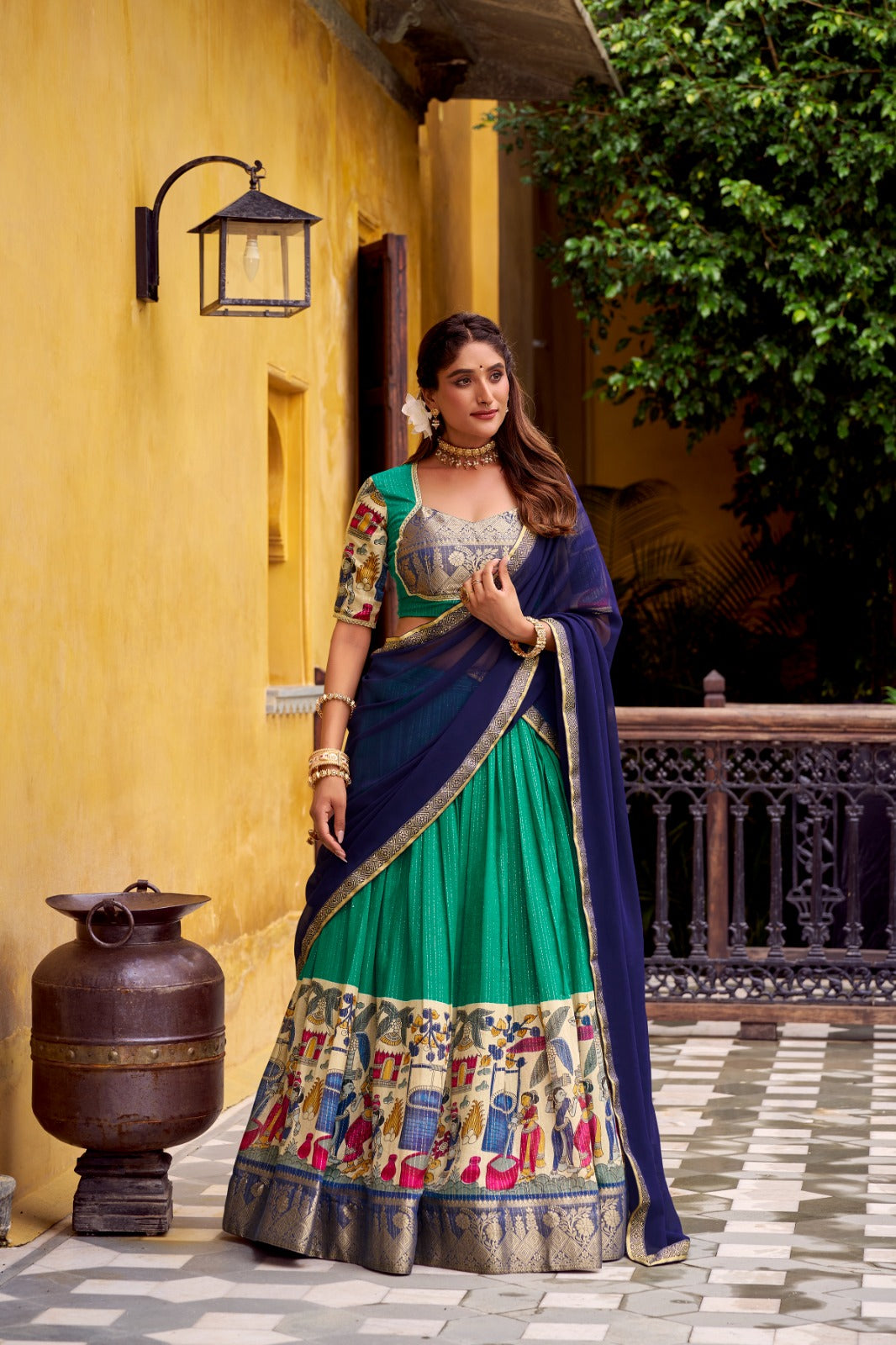 Kyatri New Elegance with this Poly Chanderi lehenga, designed with delicate Zari stripes and enhanced with Kalamkari prints