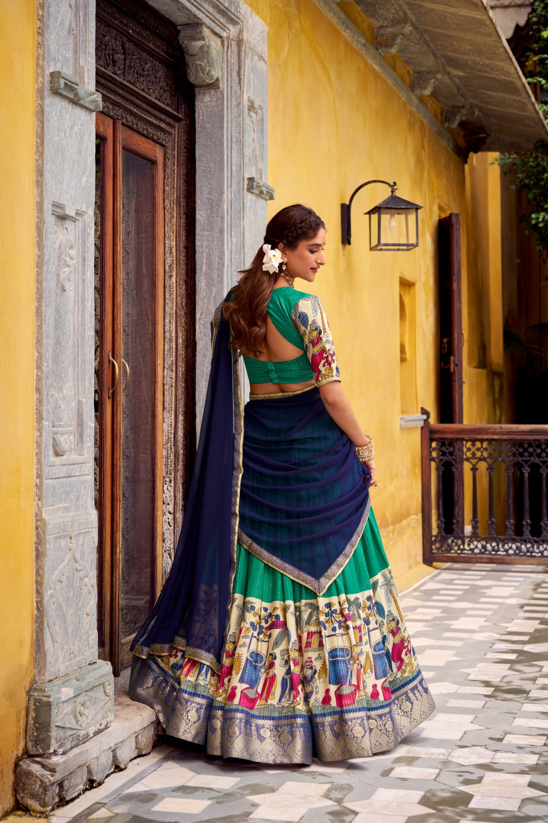 Kyatri New Elegance with this Poly Chanderi lehenga, designed with delicate Zari stripes and enhanced with Kalamkari prints