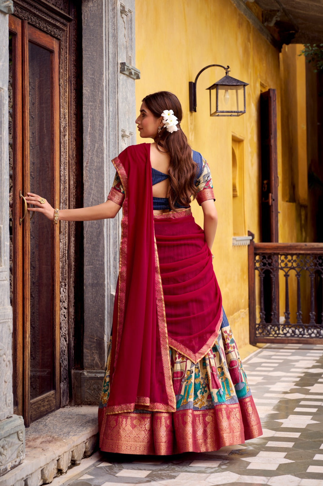 Kyatri New Elegance with this Poly Chanderi lehenga, designed with delicate Zari stripes and enhanced with Kalamkari prints