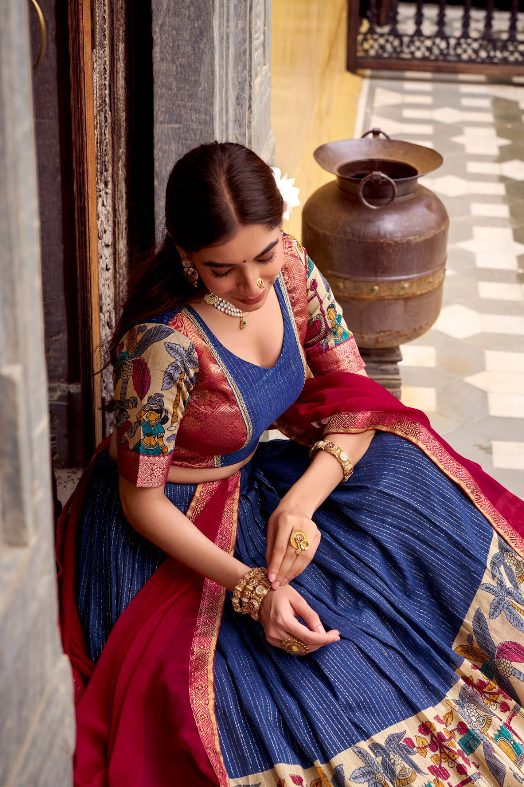 Kyatri New Elegance with this Poly Chanderi lehenga, designed with delicate Zari stripes and enhanced with Kalamkari prints